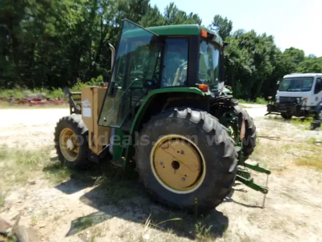2002 JOHN DEERE 6410 4X4 TRACTOR WITH 2002 TIGER BOOM MOWER ATTACHMENT
