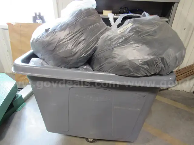 Several Bags Of Black Utility Pants