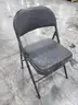 8 Black Folding Chairs (E)