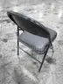 8 Black Folding Chairs (E)