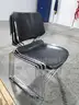 4 Black Stackable Chairs (A)