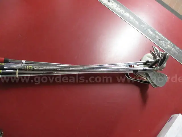 Golf clubs - Taylormade putter with cover, Nike 60 degree wedge and Wilson Staff P, 4, 5, 6, 7, 8 and 9 irons