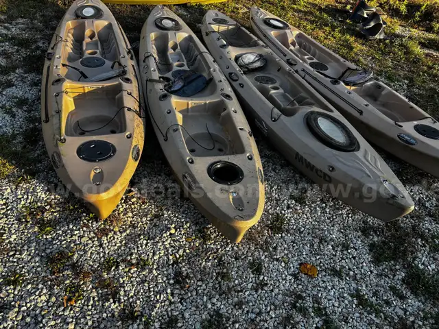 4 sit on Kayaks