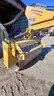 Skid steer roller attachment
