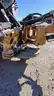 Skid steer roller attachment