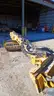 Skid steer roller attachment