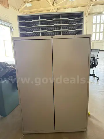 Set of one metal storage cabinet with a letter organizer tray