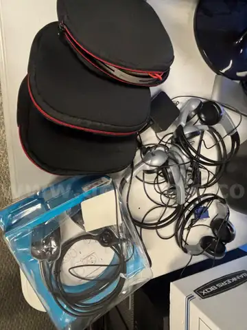 Eight (8) headphones, variety in styles/sizes