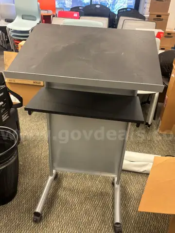 One (1) metal, black & grey stand with wheels