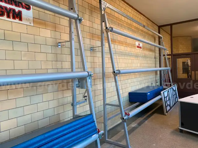 Wall Racks to hold Rolls of Wrestling Mats