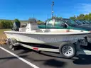 LOT OF A BOAT WITH TRAILER AND MOTOR