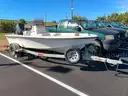 LOT OF A BOAT WITH TRAILER AND MOTOR