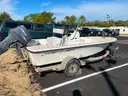 LOT OF A BOAT WITH TRAILER AND MOTOR