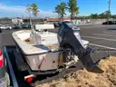 LOT OF A BOAT WITH TRAILER AND MOTOR
