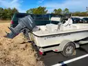 LOT OF A BOAT WITH TRAILER AND MOTOR