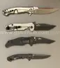 LOT OF 4 ZERO TOLERANCE POCKET KNIVES - USED!