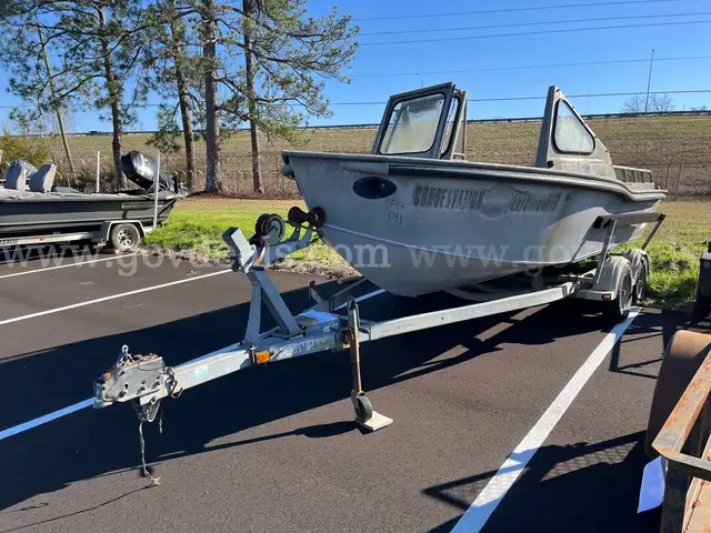 LOT OF A BOAT WITH TRAILER AND MOTOR