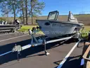 LOT OF A BOAT WITH TRAILER AND MOTOR