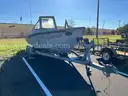 LOT OF A BOAT WITH TRAILER AND MOTOR