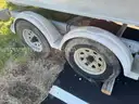 LOT OF A BOAT WITH TRAILER AND MOTOR