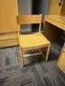 dormitory furniture, including beds, desk, wardrobes, and chairs.