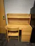 dormitory furniture, including beds, desk, wardrobes, and chairs.
