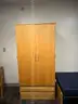 dormitory furniture, including beds, desk, wardrobes, and chairs.