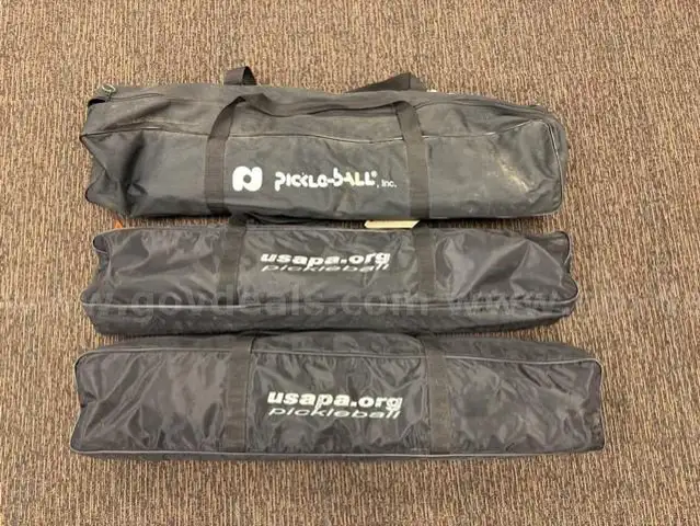 Three (3) portable pickleball nets