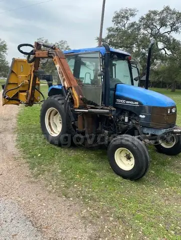 New Holland TS100 80 HP Tractor w/Alamo Boom Shredder | AllSurplus