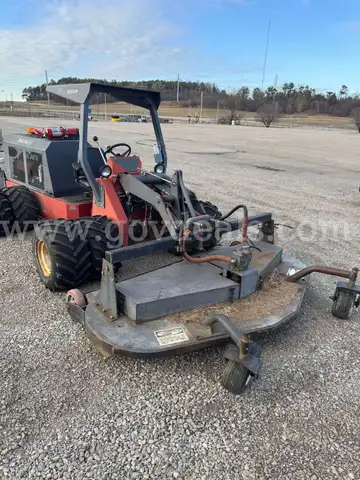Power Trac with deck, blade, bucket, and side arm