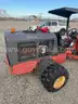 Power Trac with deck, blade, bucket, and side arm