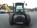 John Deere 6115M with extended mower attachment.