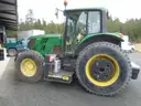 John Deere 6115M with extended mower attachment.