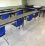 Used classroom chairs and folding classroom tables. (FR304)