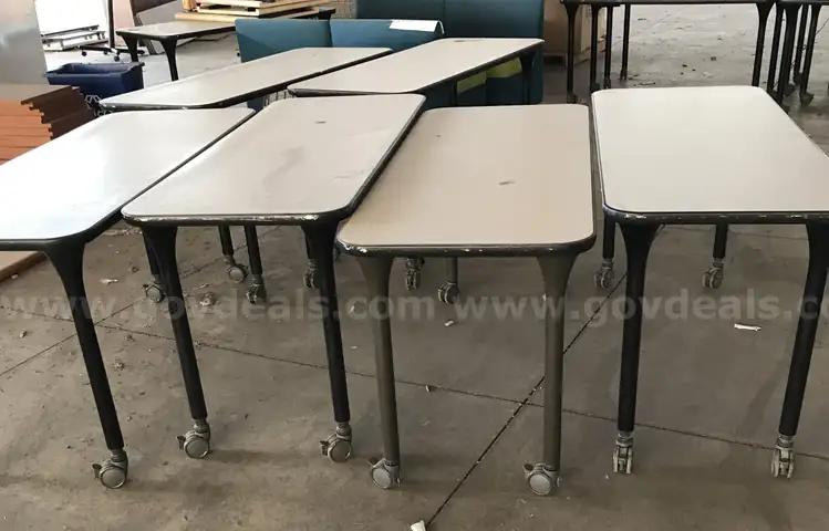 6 used rolling classroom tables. (S2)