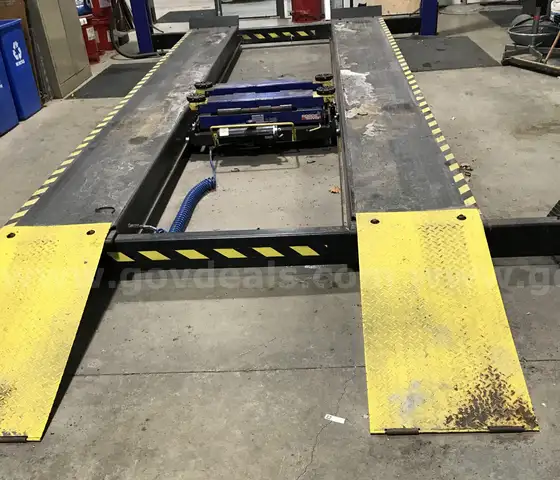 Used Wheeltronic car lift. (FG)