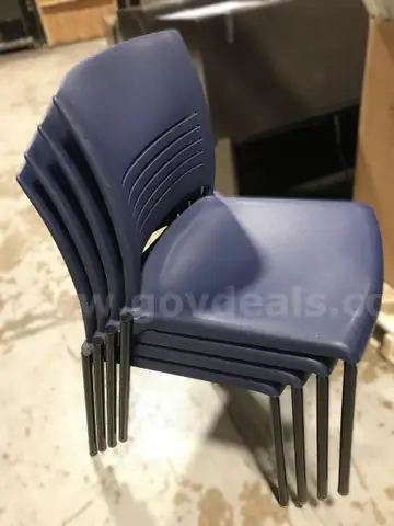 4 used blue stackable chairs. (OP)
