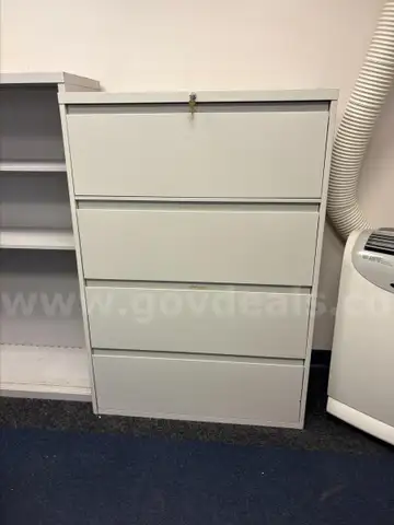 The lot is for a used 4 drawer lateral filing cabinet. (FM)