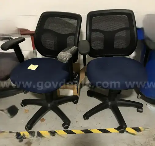 2 used blue and black rolling office chairs. (OP)