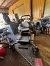 Cub Cadet Commercial Tank Zero Turn Mower equipped with a &#x22;ride-on sprayer&#x22; attachment,