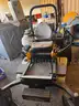 Cub Cadet Commercial Tank Zero Turn Mower equipped with a &#x22;ride-on sprayer&#x22; attachment,