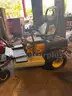Cub Cadet Commercial Tank Zero Turn Mower equipped with a &#x22;ride-on sprayer&#x22; attachment,