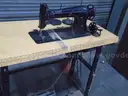 Vintage  sewing machine with table. Table has foot and knee pedal