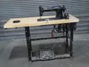 Vintage  sewing machine with table. Table has foot and knee pedal