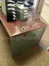 Metal Desk with Assorted Office Accessories and Wooden Cabinet