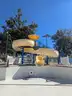 USA Slide 19&#x27; Tall Pool Slide with attached Staircase and Canopy and Surrounding Fence