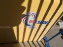 USA Slide 19&#x27; Tall Pool Slide with attached Staircase and Canopy and Surrounding Fence