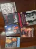 Box of over 100 DVDs (See photos for titles/quantities/photos)