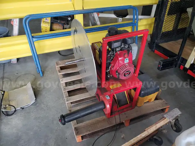 Gasoline powered hose roller