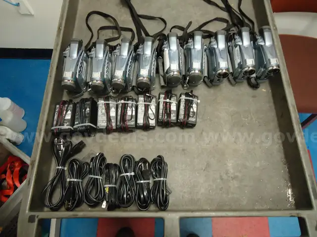 Lot of 9 Canon ZR 80 hand held camcorders.